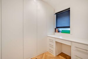 bedroom with dressing area in a house for sale on the Wirral