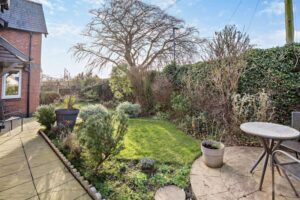 the lawned garden at a modern detached house for sale on a small quiet development in Farndon