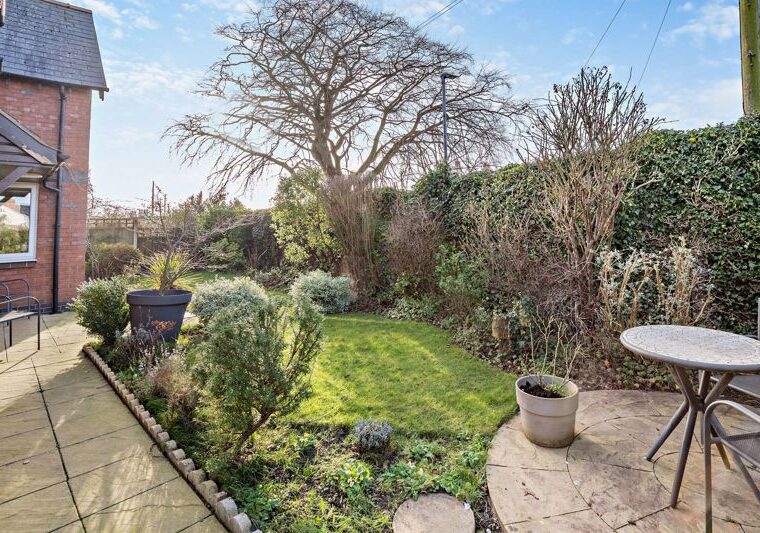 the lawned garden at a modern detached house for sale on a small quiet development in Farndon