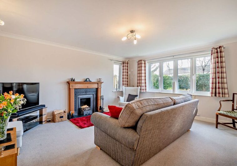 the sitting room with open fire in a house for sale in Farndon marketed by Rickitt Partnership estate agents